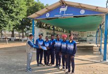 Distribution of track suits to sheep farmers