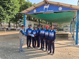 Distribution of track suits to sheep farmers