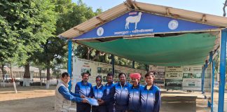 Distribution of track suits to sheep farmers