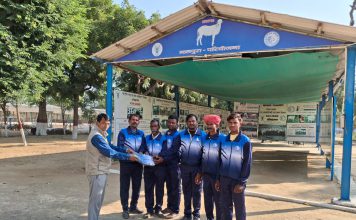 Distribution of track suits to sheep farmers